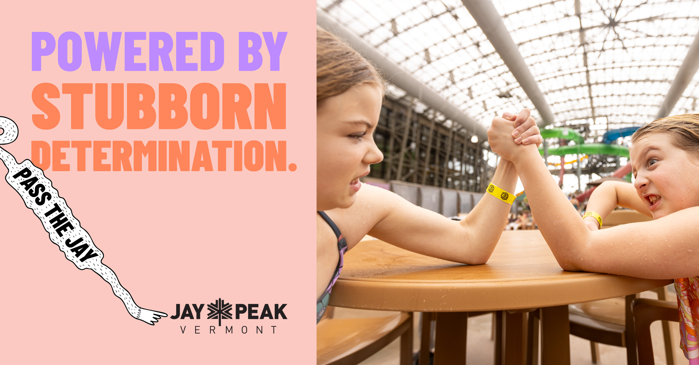girls arm wrestling at indoor waterpark with text overlay