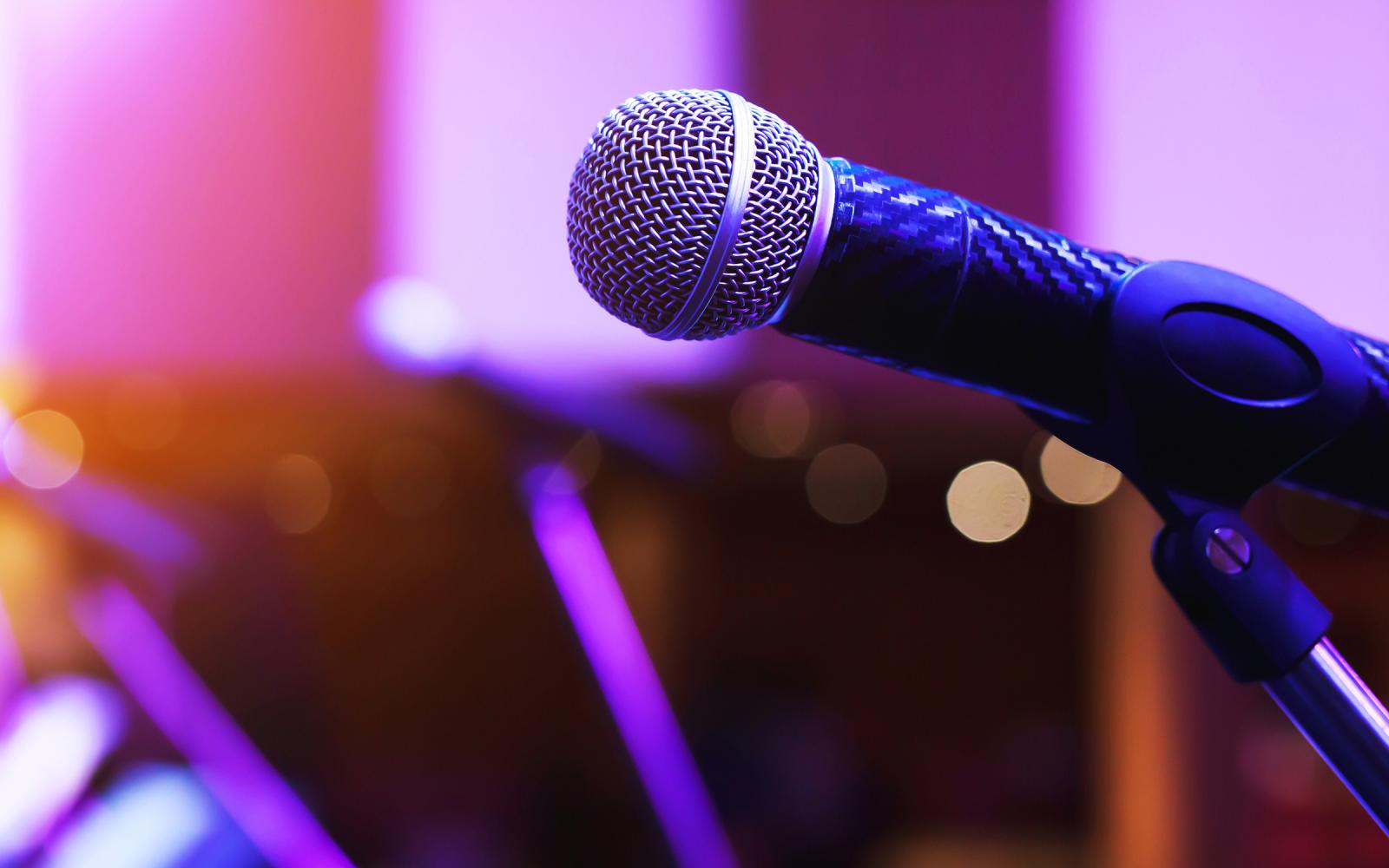 Microphone under colorful stage lights.